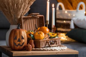 A,Wicker,Basket,With,Pumpkins,,Jack's,Pumpkin,And,Candles,In