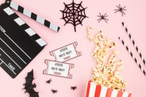 Movie,Clapperboard,And,Halloween,Decoration,Over,Pink,Background.,Horror,Movie