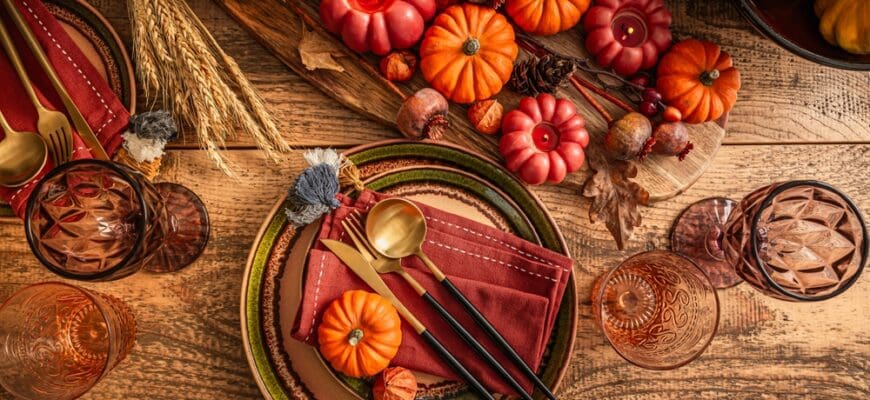 Festive,Thanksgiving,Table,Setting,With,Pumpkins,And,Candles,In,Orange